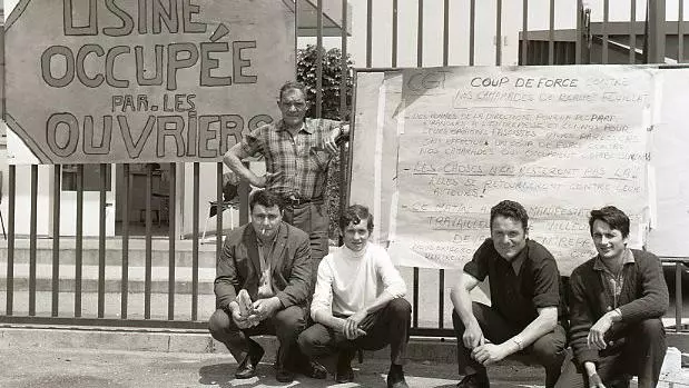 French workers with placard during occupation of their factory