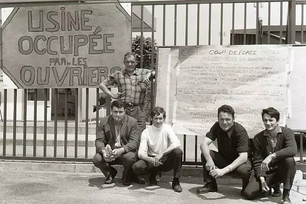 French workers with placard during occupation of their factory
